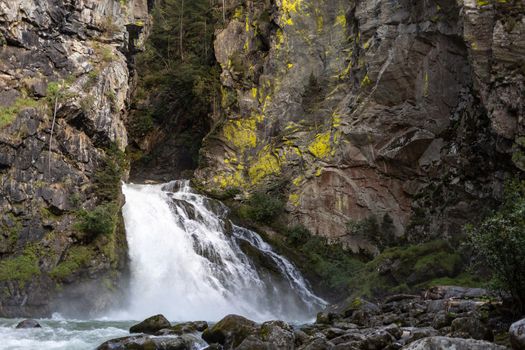 waterfall between old rocks beautiful nature background. High quality photo