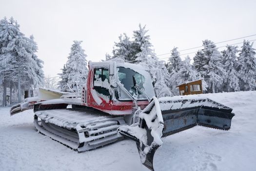 Red snow powder, blower under snow on Wasserkuppe in Rhoen Hesse Germany ski resort on snowy mountain after fresh snow fall. High quality photo