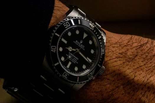 LJUBLJANA, SLOVENIA - December 12, 2021: Luxury watch Rolex Oyster Perpetual close up with selective focus. High quality photo