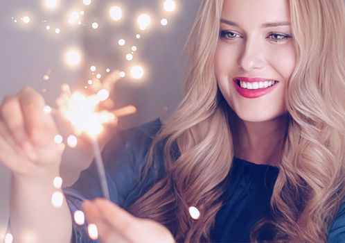 Holiday magic, Christmas and New Year celebration, happy woman with sparklers, portrait