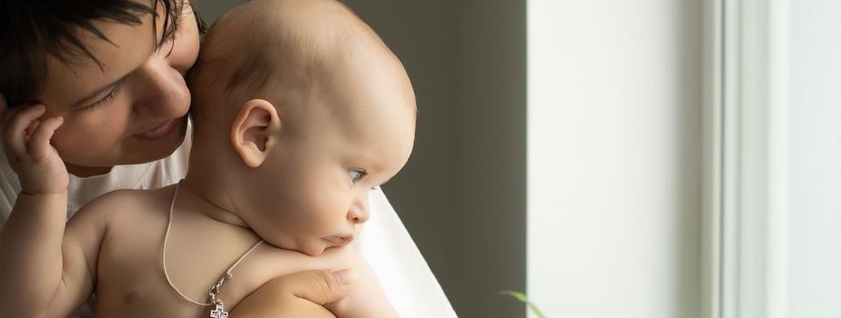 Portrait of a mother with her 6 months old baby, top view point.