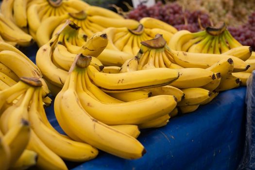 Bunch of ripened bananas at grocery store at a local market