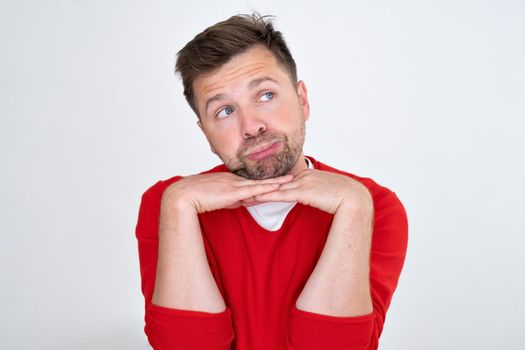 Confident young man looking away dreaming. Funny handsome guy hinking about the future. Closeup face of smiling casual man 