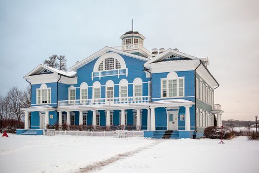 An old beautiful mansion with a wooden veranda, built in the 19th century. A big old house with a garden in Cherepovets, Russia. The building houses a museum 