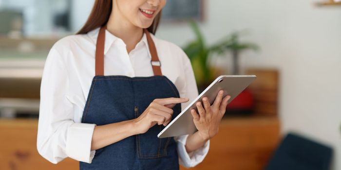 Portrait of Startup successful small business owner in coffee shop. SME entrepreneur seller business concept.