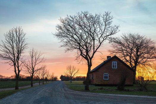 Skals, Denmark, February, 2022: Farmhouse in Winter at Dawn.