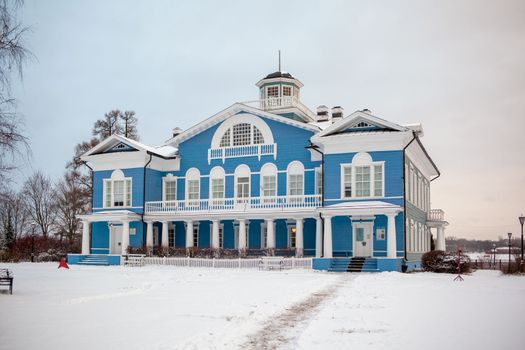 An old beautiful mansion with a wooden veranda, built in the 19th century. A big old house with a garden in Cherepovets, Russia. The building houses a museum 