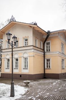 An old beautiful mansion with a wooden veranda, built in the 19th century. A big old house with a garden in Cherepovets, Russia. The building houses a museum 