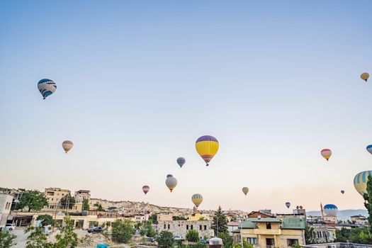 Colorful hot air balloon flying over Cappadocia, Turkey.