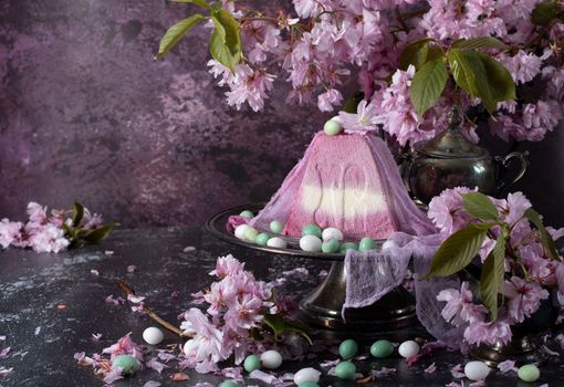 sweet curd orthodox easter on the background of purple sakura flowers, traditional food, sweet home, High quality photo