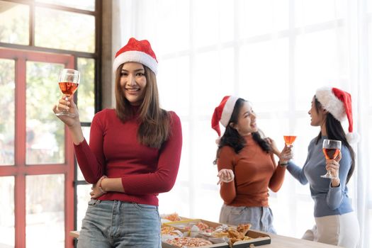 Group of young asian office girl friends having fun, talking and eating pizza together with happiness and fun. Lifestyle Concept.