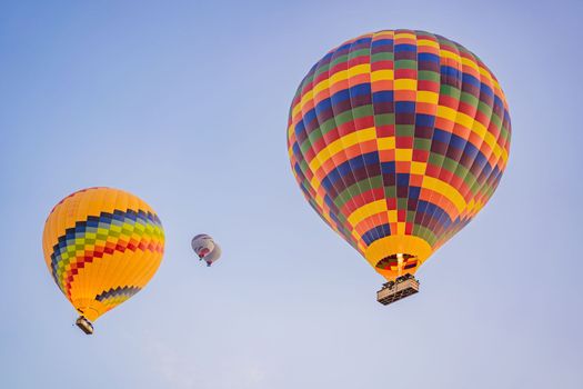 Beautiful hot air balloons over blue sky.