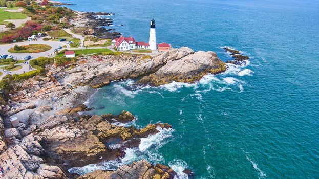 Image of Wide panorama aerial over Portland Head lighthouse with rocky coast
