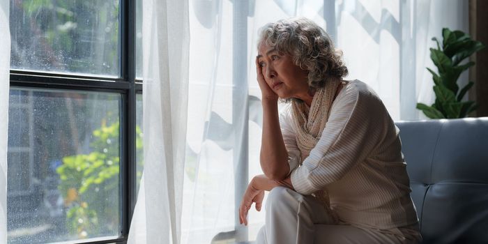 Pensive older woman lonely old senior in is home.