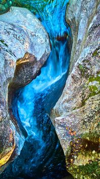 Image of Looking down raging rapids river funneling between two walls of rock in detail