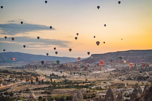 Colorful hot air balloon flying over Cappadocia, Turkey.