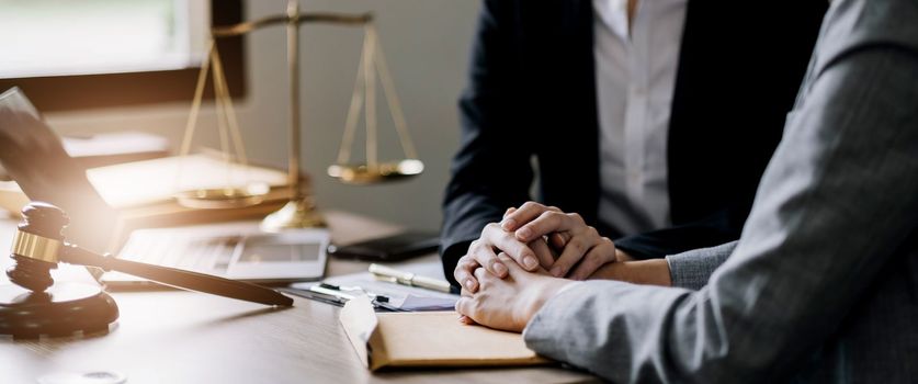 Justice and attorney concept. Lawyer meeting and consoling solution to his client provide legal advice and trust commitment strain serious for problem..