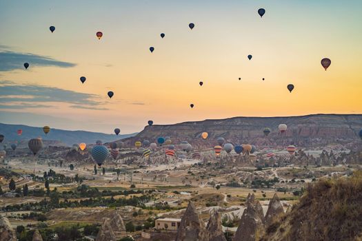 Colorful hot air balloon flying over Cappadocia, Turkey.