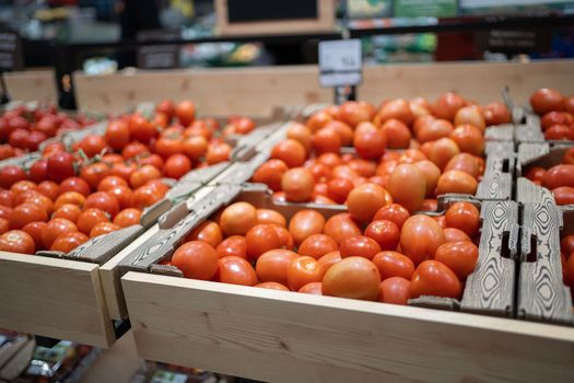 Fresh organic red pear tomatoes in a supermarket.