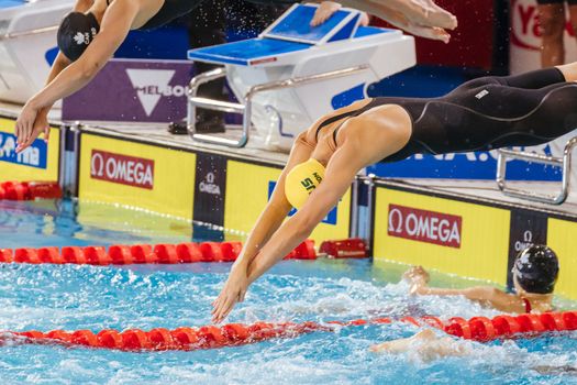 MELBOURNE, AUSTRALIA - DECEMBER 13: Emma MCKEON (AUS) on her way to winning the Women's 4x100m Freestyle final on day one of the 2022 FINA World Short Course Swimming Championships at Melbourne Sports and Aquatic Centre on December 13, 2022 in Melbourne, Australia
