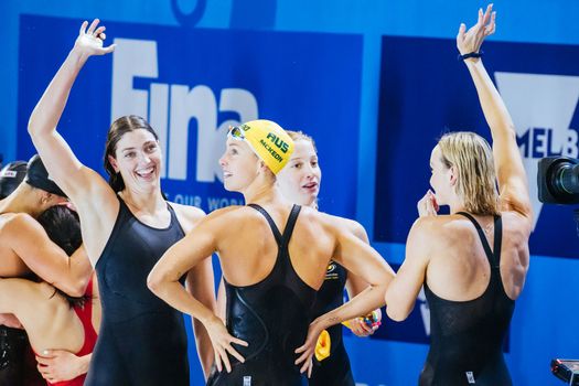 MELBOURNE, AUSTRALIA - DECEMBER 13: Gold medallists Emma McKeon, Meg Harris, Mollie O'Callaghan and Madison Wilson of Australia after winning the Women's 4x100m Freestyle final on day one of the 2022 FINA World Short Course Swimming Championships at Melbourne Sports and Aquatic Centre on December 13, 2022 in Melbourne, Australia