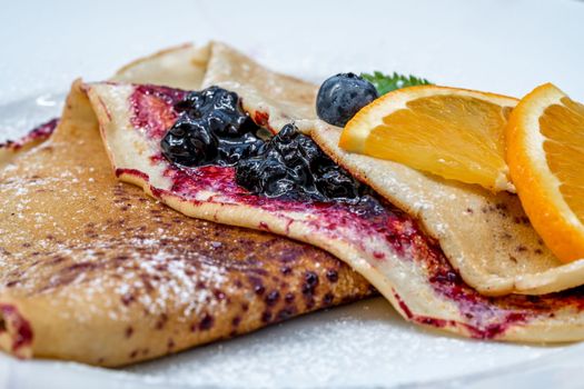 pancake with fruit and marmalade for breakfast and as dessert.