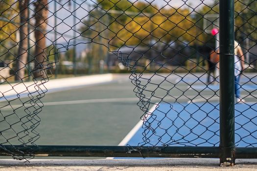 Hole in the fence. Mesh wire boundary. Steel mesh barrier fence. Chain link fence with Hole. 