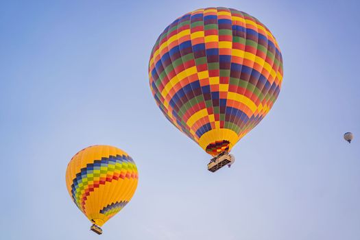 Beautiful hot air balloons over blue sky.