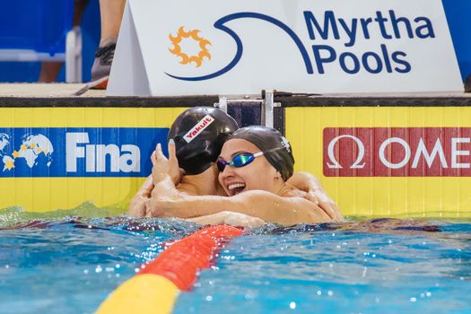 MELBOURNE, AUSTRALIA - DECEMBER 16: Kylie MASSE (CAN) congratulates Margaret MACNEIL (CAN) for winning the Women's 50m Backstroke final on day four of the 2022 FINA World Short Course Swimming Championships at Melbourne Sports and Aquatic Centre on December 16, 2022 in Melbourne, Australia