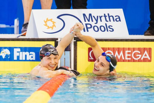 MELBOURNE, AUSTRALIA - DECEMBER 16: Kylie MASSE (CAN) congratulates Margaret MACNEIL (CAN) for winning the Women's 50m Backstroke final on day four of the 2022 FINA World Short Course Swimming Championships at Melbourne Sports and Aquatic Centre on December 16, 2022 in Melbourne, Australia