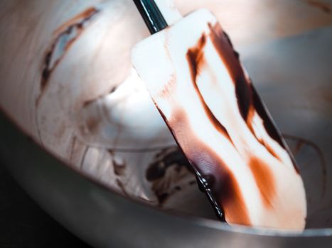 dirt spatula and metal bowl after mixing a filling for a piping bag