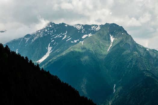 Fabulous magnificent view of Caucasus Mountains and sky. High quality photo