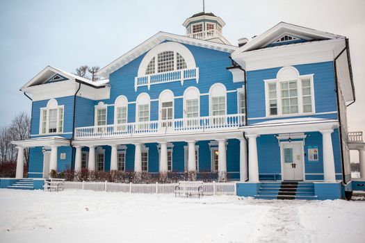 An old beautiful mansion with a wooden veranda, built in the 19th century. A big old house with a garden in Cherepovets, Russia. The building houses a museum 