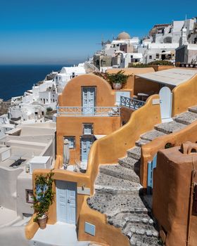 Oia village Santorini with blue domes and whitewashed house during sunset at the Island of Santorini Greece Europe, sunrise Santorini.