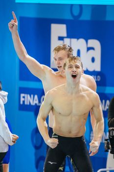 MELBOURNE, AUSTRALIA - DECEMBER 16: Team USA and Carson FOSTER celebrates winning the Men's 4x200m Freestyle final on day four of the 2022 FINA World Short Course Swimming Championships at Melbourne Sports and Aquatic Centre on December 16, 2022 in Melbourne, Australia