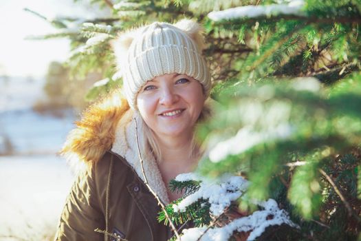 Beautiful girl in the winter forest in Denmark.