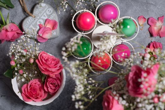 colorful easter eggs scattered on gray concrete background, top view, High quality photo