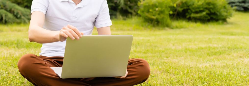 Satisfied businessman working on laptop with internet wireless.