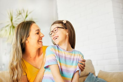 mother and daughter playing and having fun at home