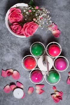 colorful easter eggs scattered on gray concrete background, top view, High quality photo