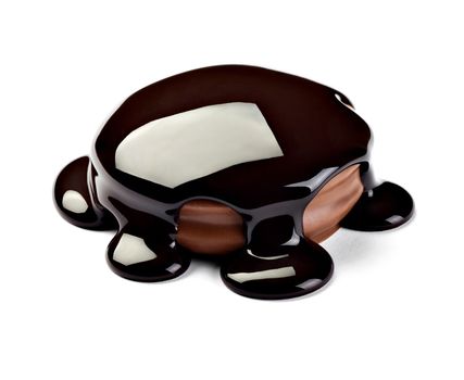 close up of a chocolate syrup on a cake on white background
