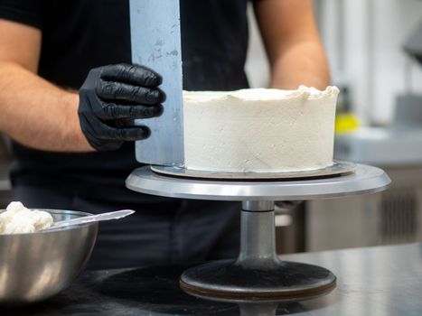 chef at work preparing a drip cake