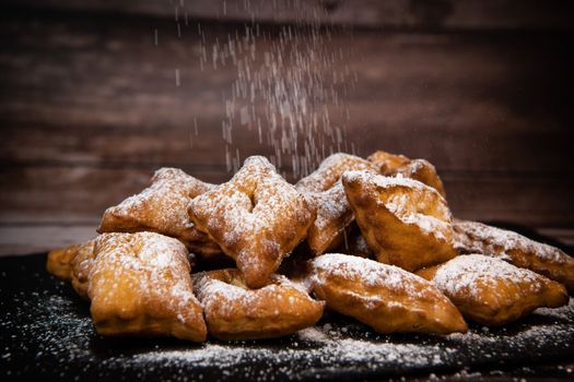 TRADITIONAL WONDERS OF SOUTH-WESTERN FRANCE, SPRINKLED WITH ICING SUGAR AND FLAVOURED WITH RUM AND ORANGE FLOWER WATER, High quality photo