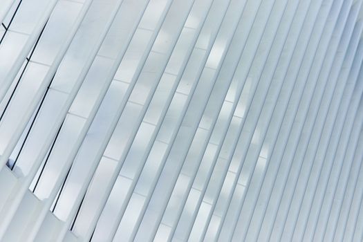 Image of Clean abstract white rib pole architecture at angle with soft light