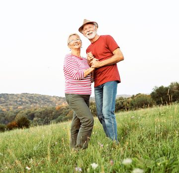 Happy active senior couple outdoors