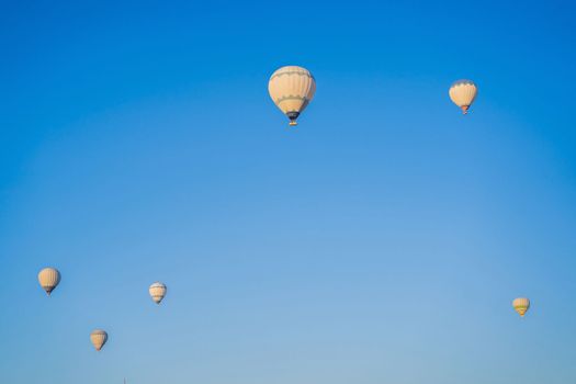 Beautiful hot air balloons over blue sky.