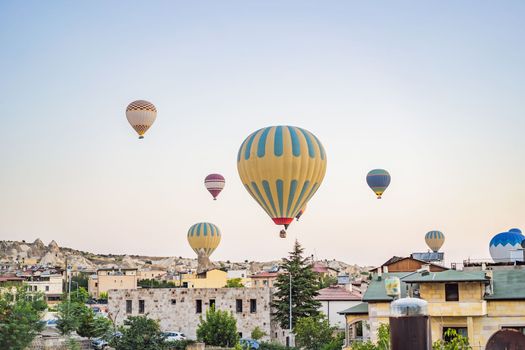 Colorful hot air balloon flying over Cappadocia, Turkey.