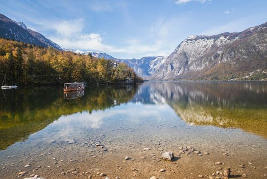 Picturesque lake Bohinj which reflects the Alps. Triglav National Park in Slovenia in autumn