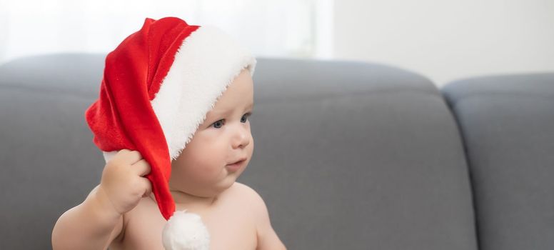 cute baby boy wearing christmas cap.