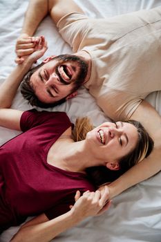 Portraitof a young couple sharing an intimate moment in bed